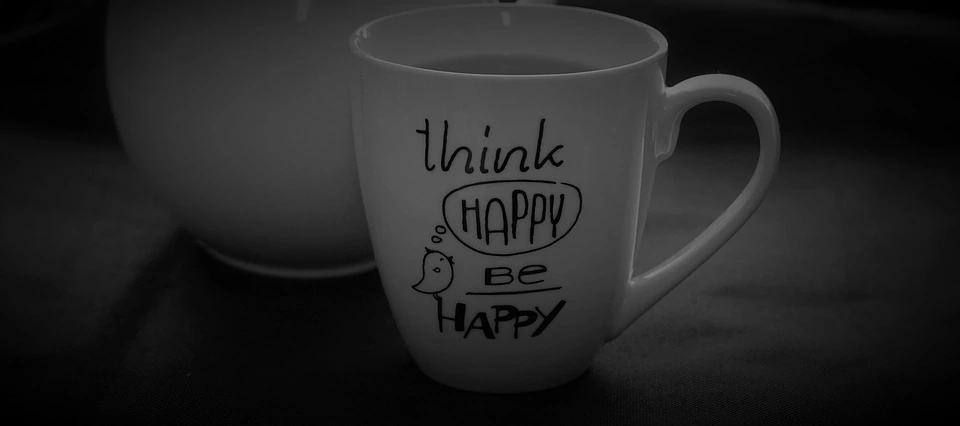 cup with writing on that says think happy be happy